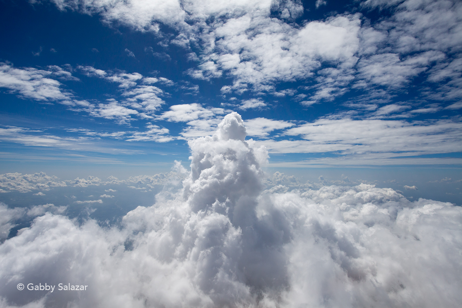 Frequent, small to moderate, explosions are common at Santiaguito. Here, a plume from Caliente rises above the clouds.